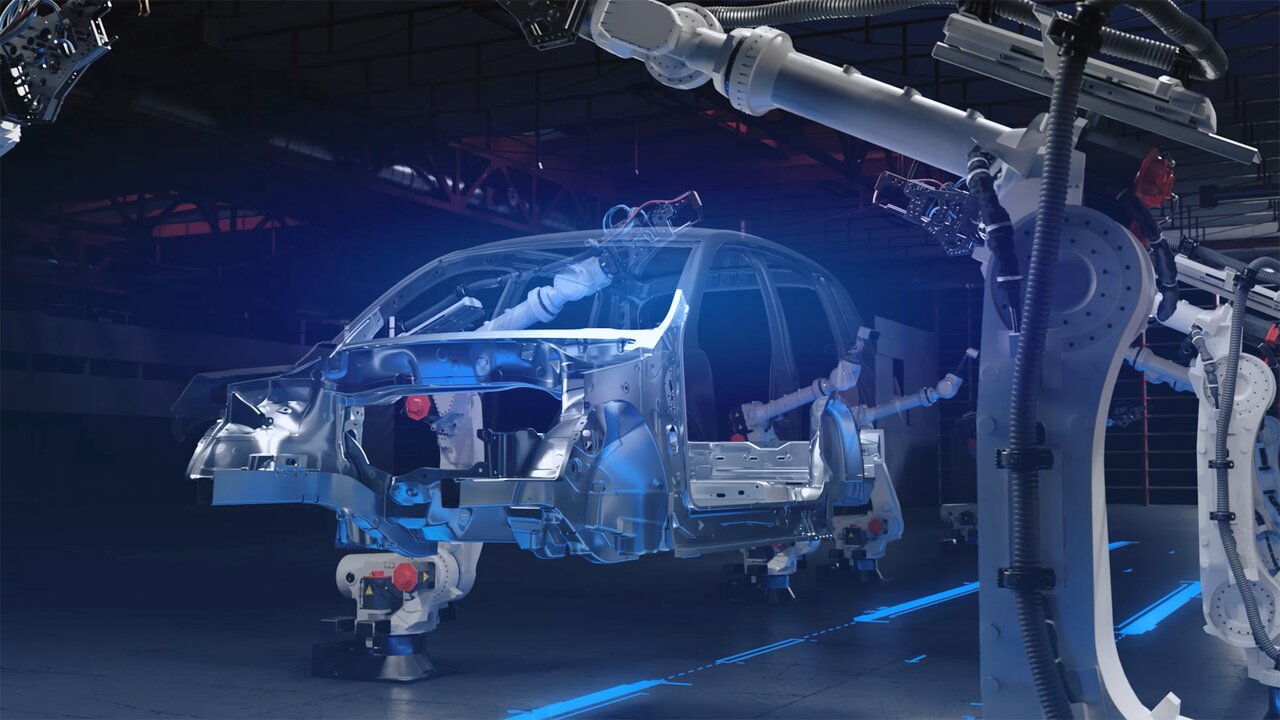 Mehrere Industrieroboter montieren eine Autokarosserie in einer Fertigungshalle.