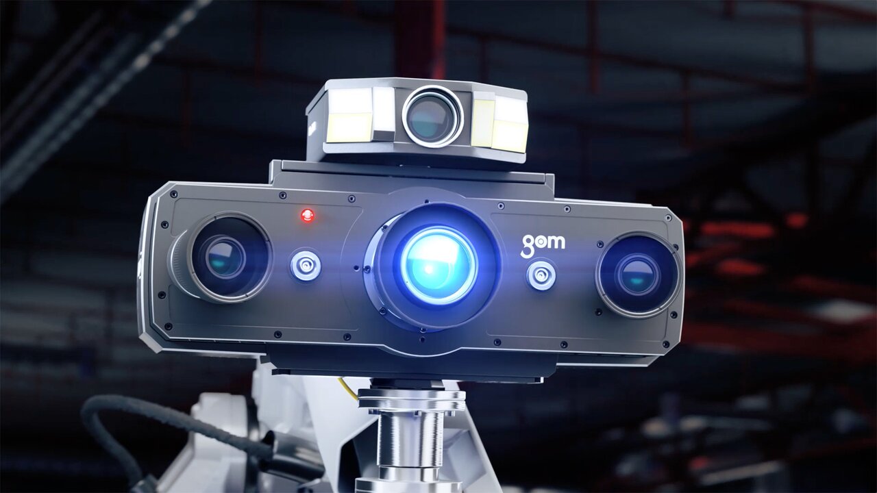 Nahaufnahme eines 3D-Scanners von GOM mit leuchtender Linse.