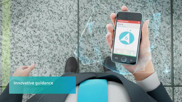 Person hält Smartphone mit Linienanzeige einer U-Bahn-App, Ansicht von oben.