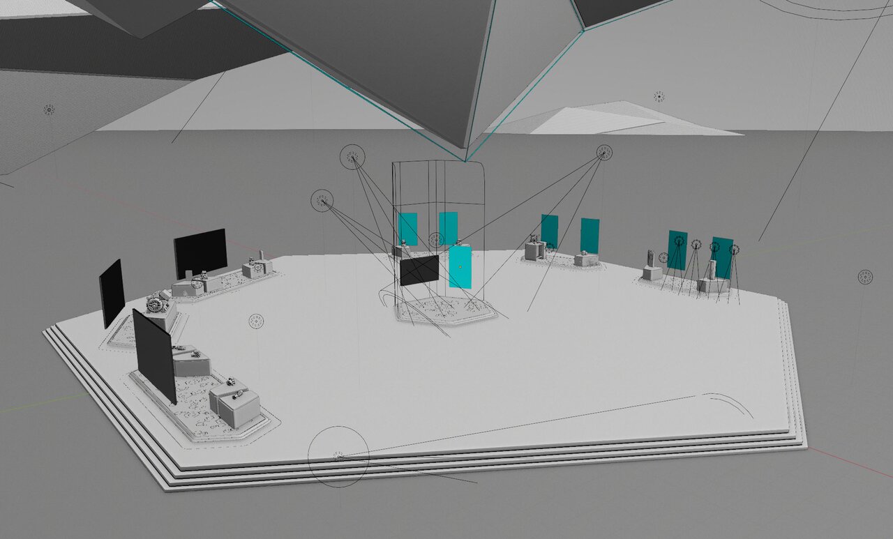 Graues 3D-Wireframe-Modell einer Ausstellungsfläche mit Exponaten, Bildschirmen und Lichtquellen. Kamerapfade und Lichtstrahlen sind technisch dargestellt.